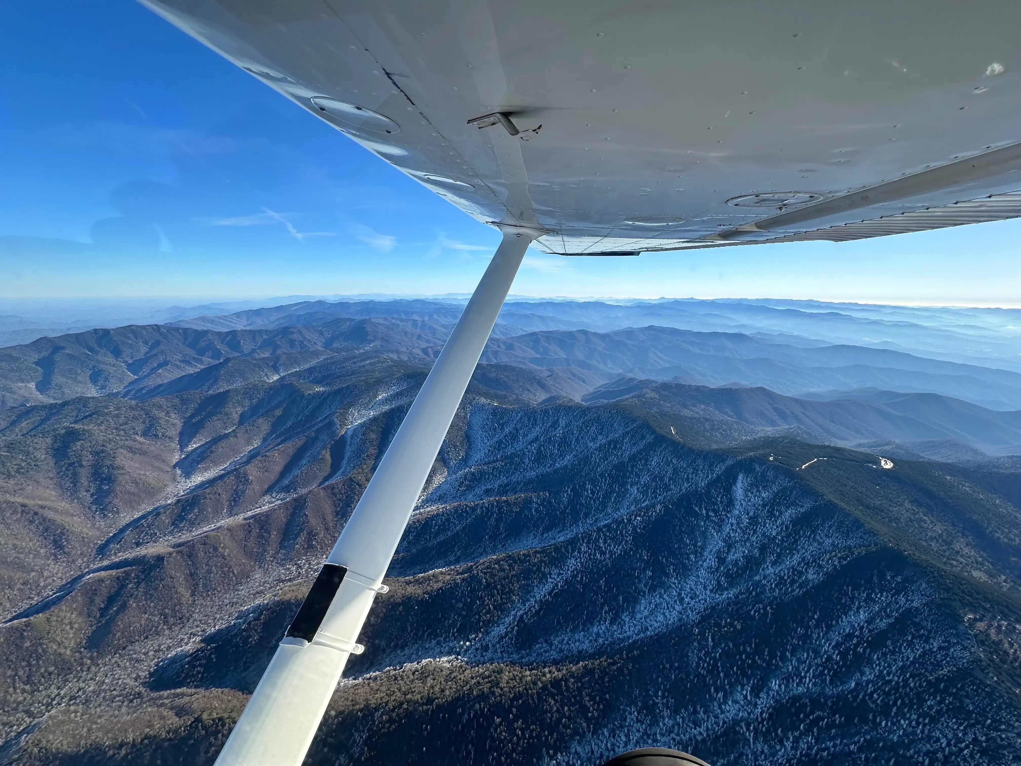 Cessna 172 parked at Speedway Flight Training during sunset